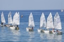 gray boats sailing during daytime
