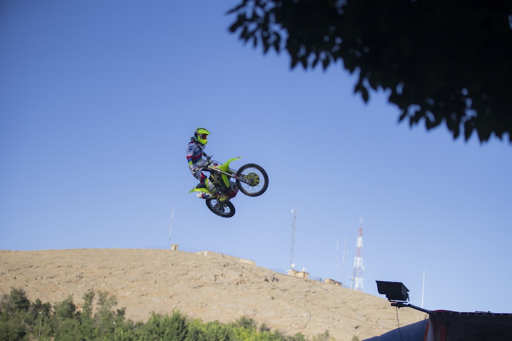 person riding motocross dirt bike