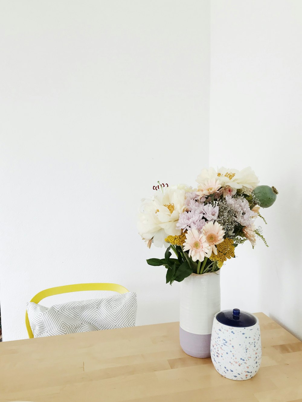 flowers centerpiece on brown wooden table