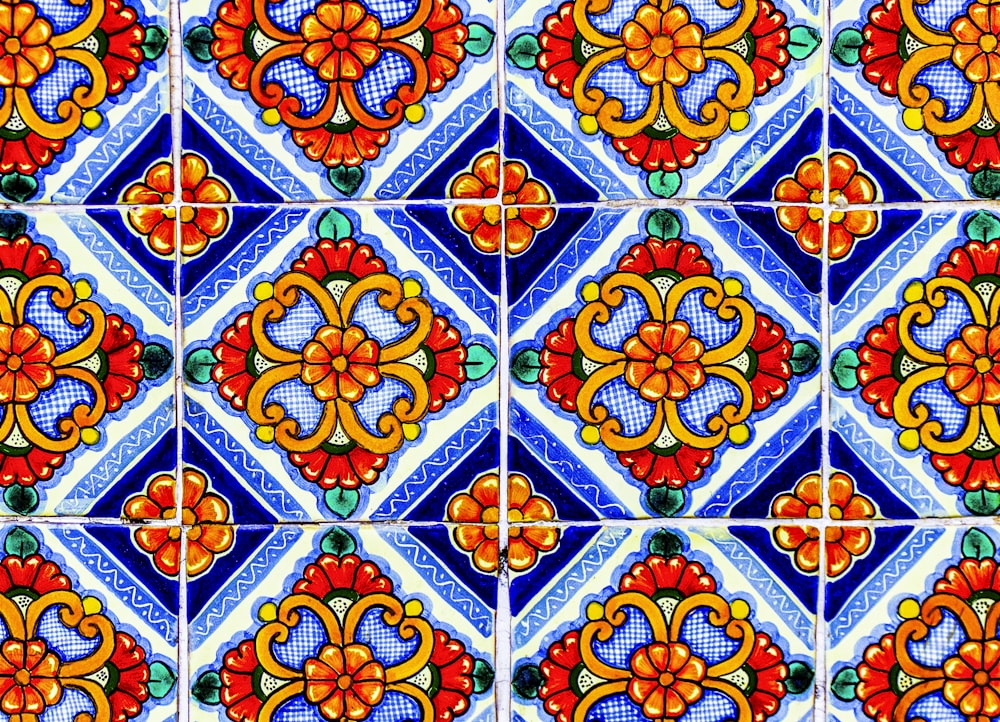 a close up of a colorful tile wall