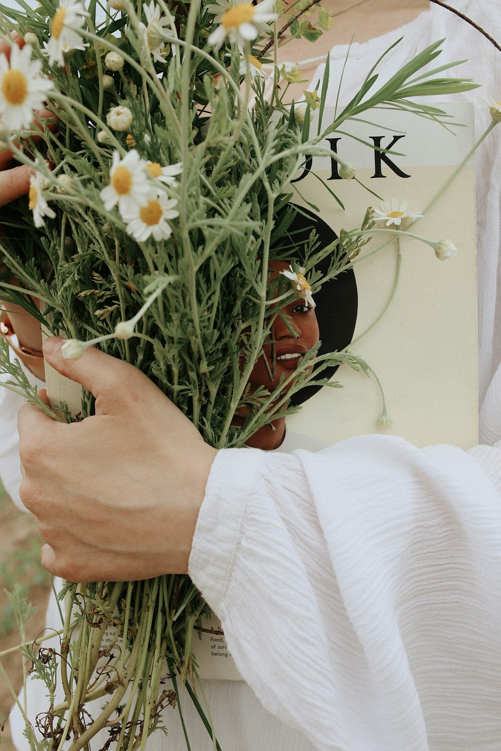 woman holding baby's-breath flowers