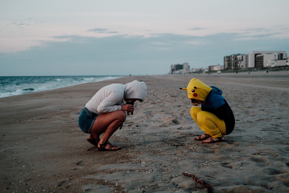 woman and child near ocean