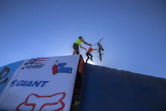 A friendly team member assisting a rider with onboarding paperwork.