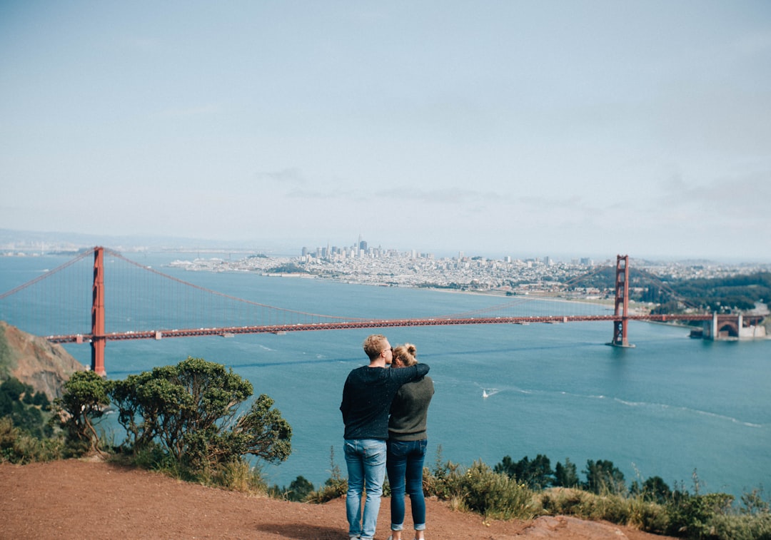 woman and man near ocean