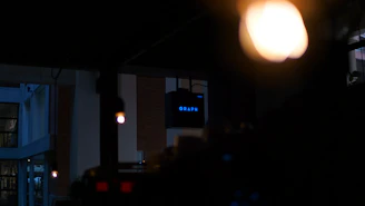 Close-up of the graphene infrared panels softly illuminating the sauna interior with a cool blue glow.