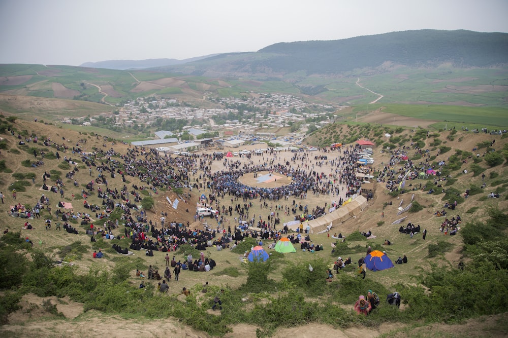 people gathering near mountain