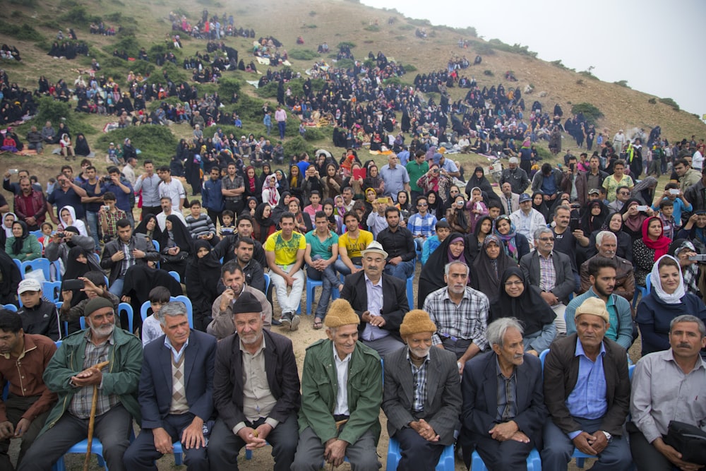 people sitting on blue bench