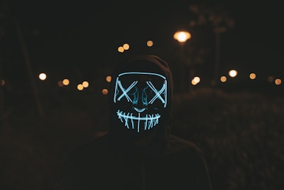 Black cosmic-themed hoodie with glowing star patterns and sleek motion lines.