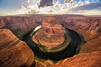 Sunset over the horseshoe-shaped bend of the Strawberry River, framed by lush Ozark foothills.