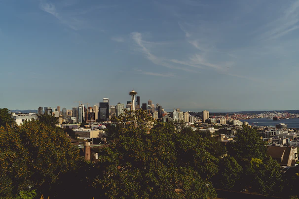 A clean, modern map interface showing Seattle landmarks with restaurant icons clustered nearby.