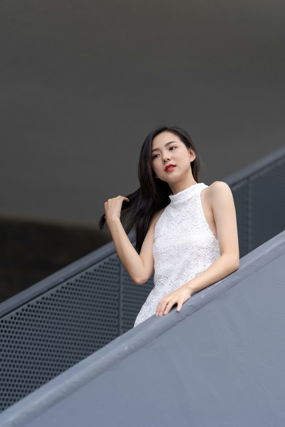 woman standing on railing