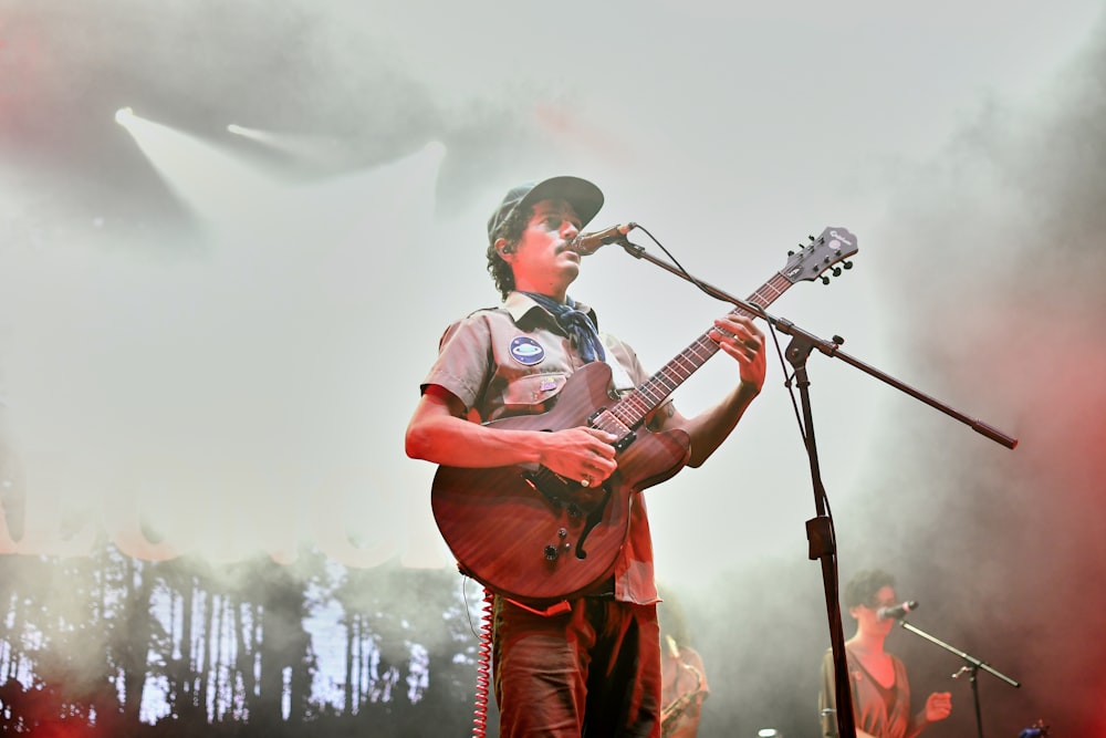 man holding guitar