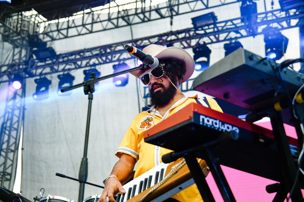 man playing electric keyboard