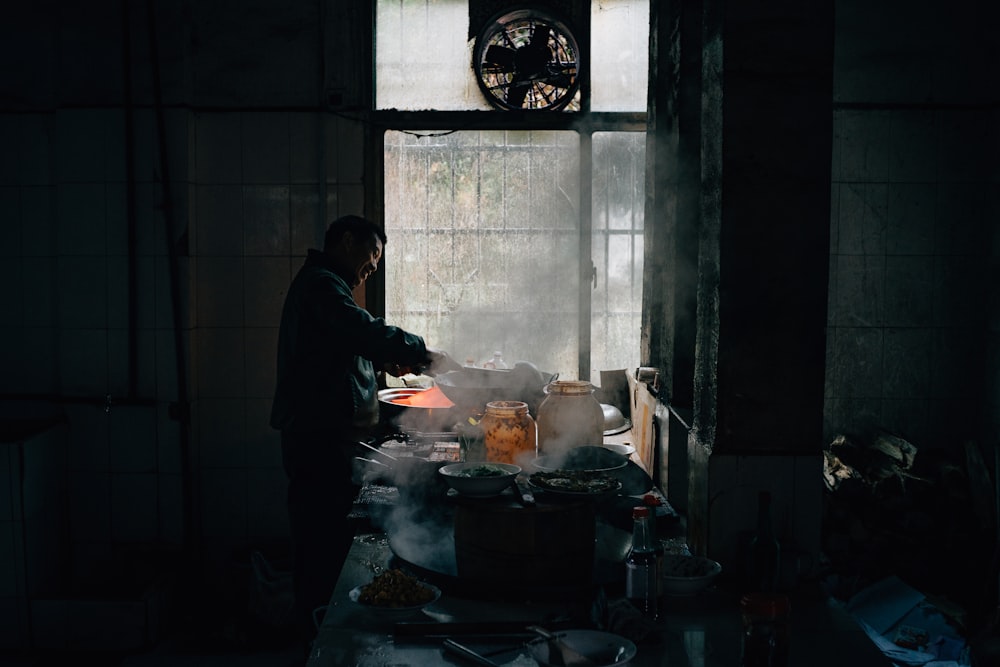 person standing near closed window