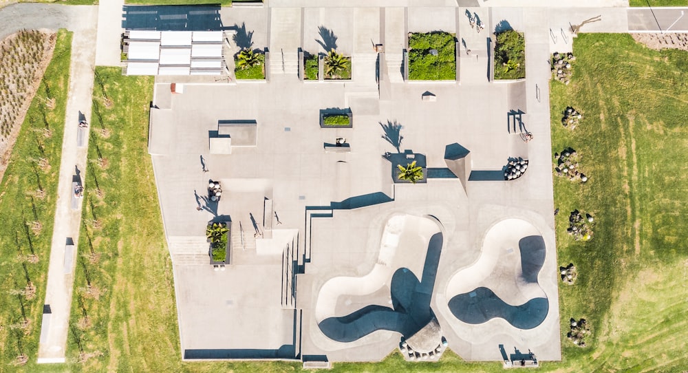 an aerial view of a skate park with ramps and ramps