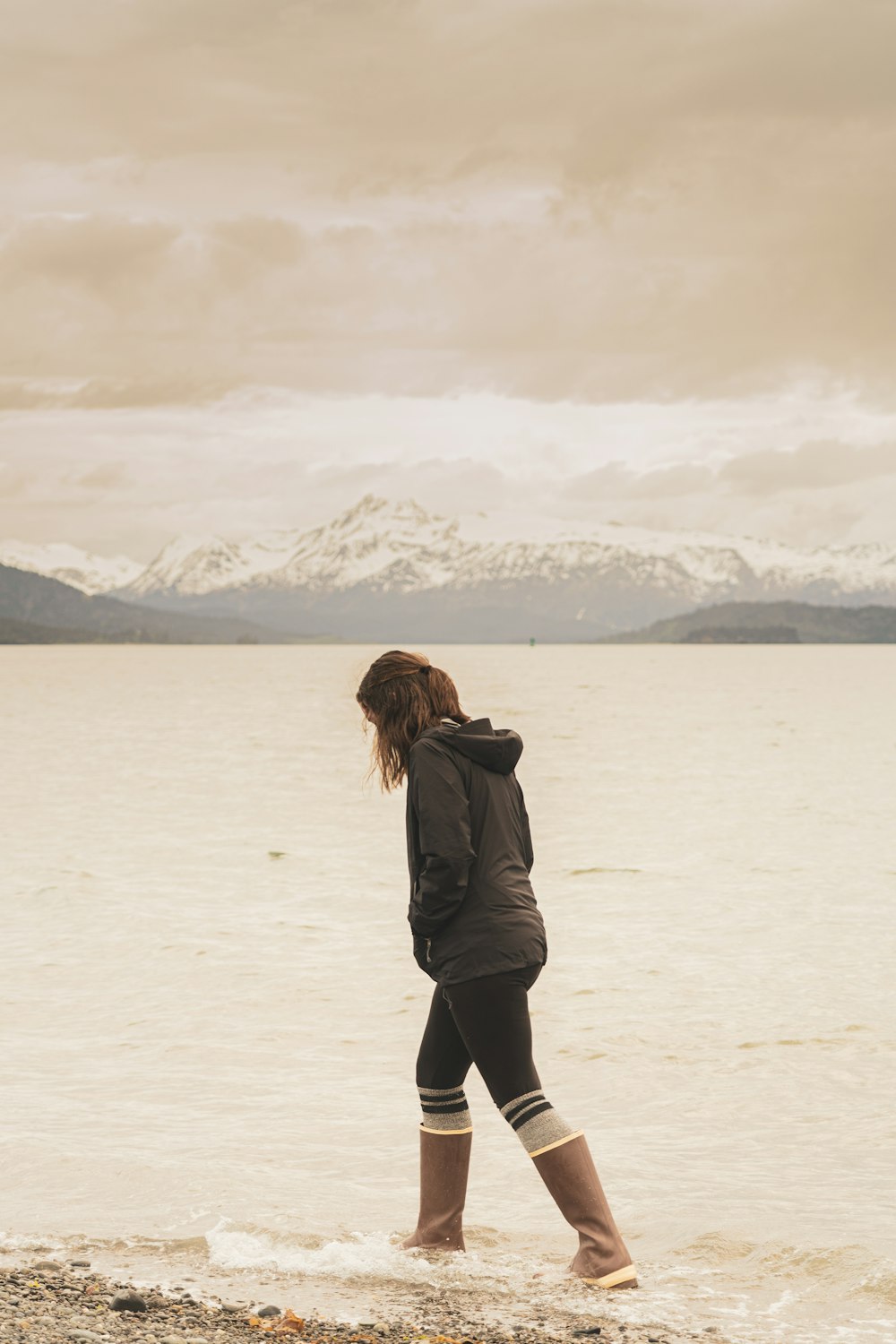 woman walking on seashore