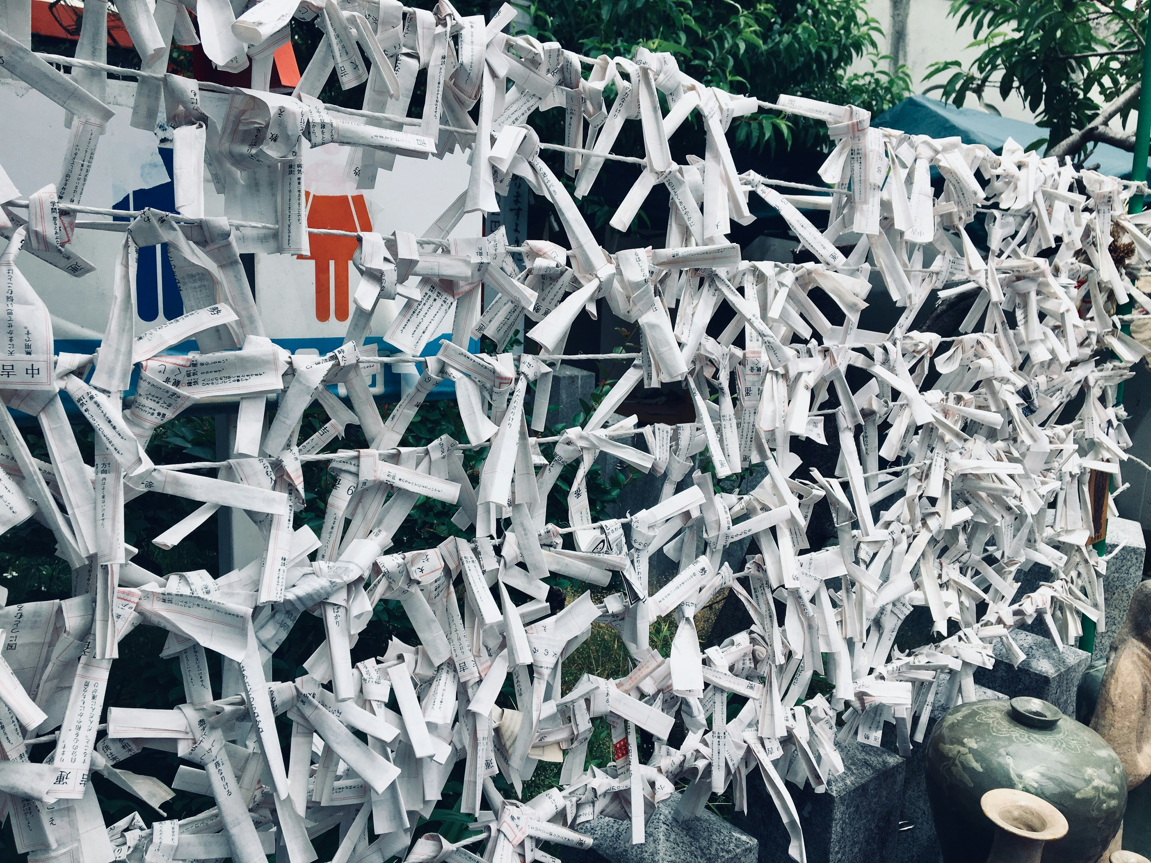 papers tied on fence ropes