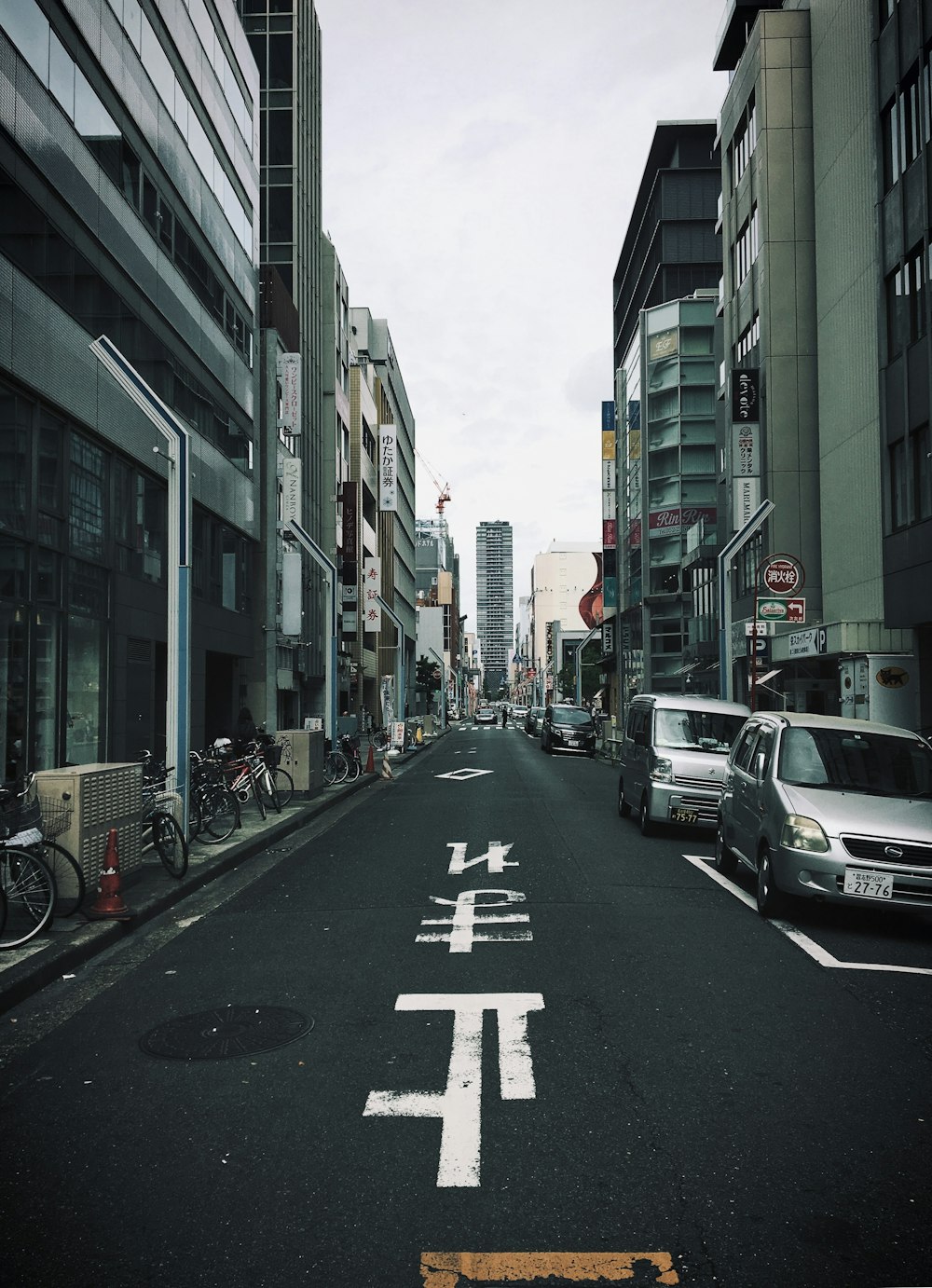 two gray cars on paved road