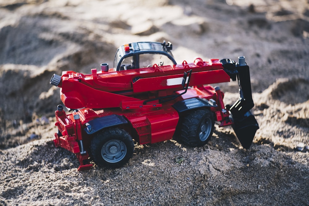 red and black heavy equipment oty