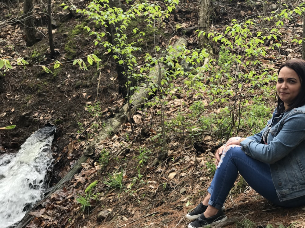 woman sitting on hill