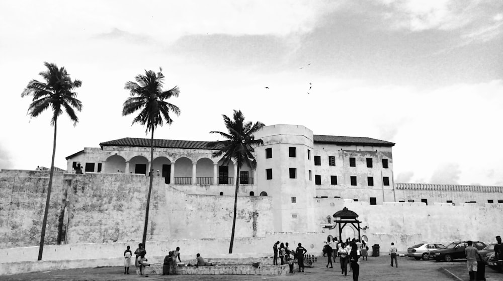 people near concrete building