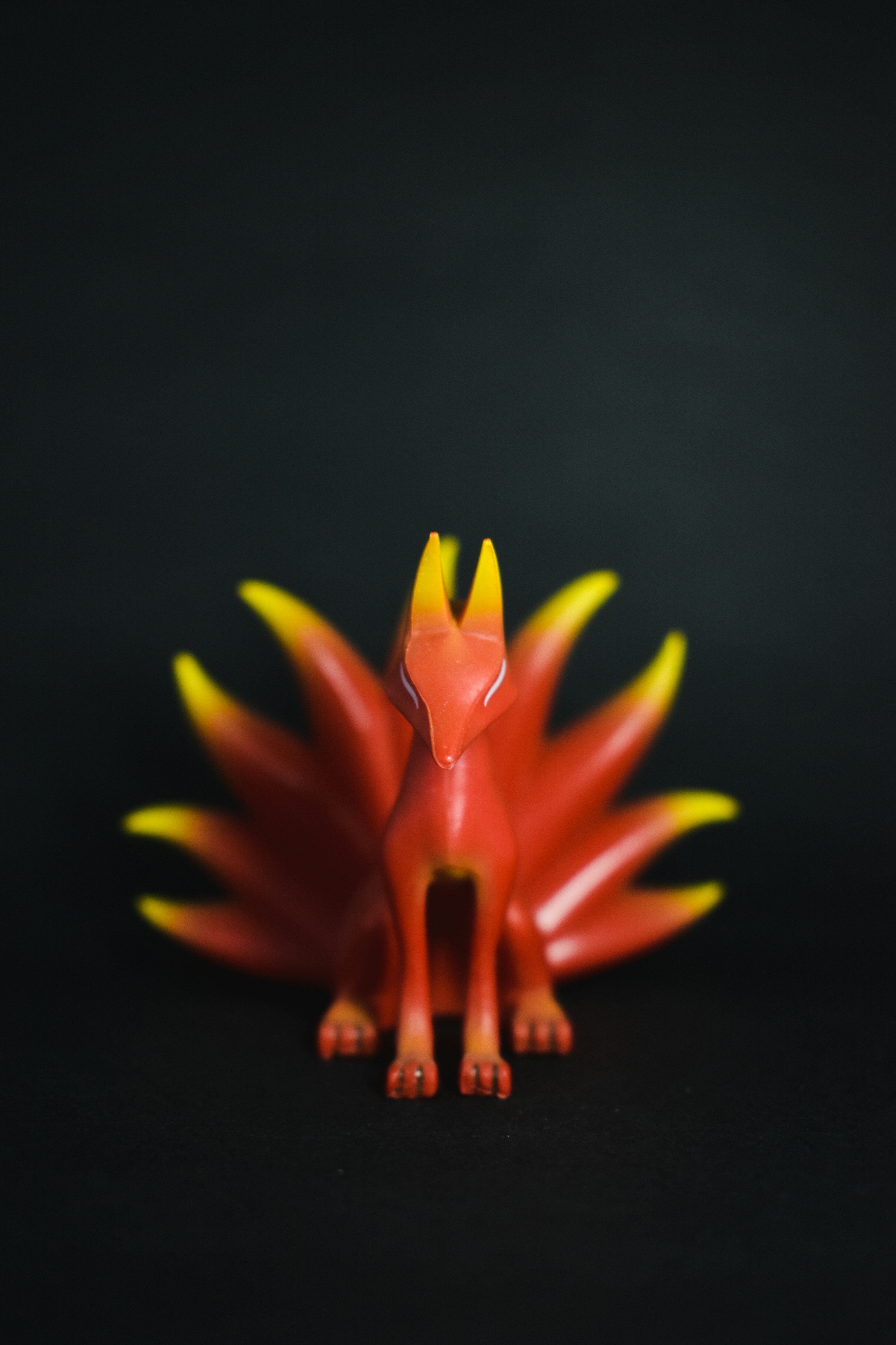 red and yellow dinosaur toy