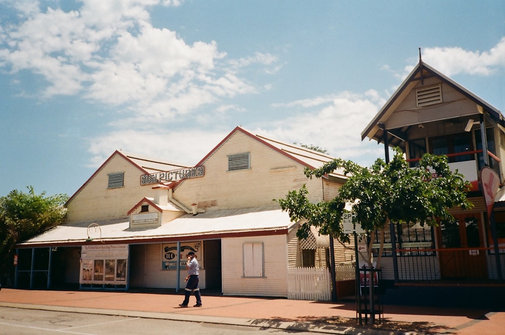 woman standing near house