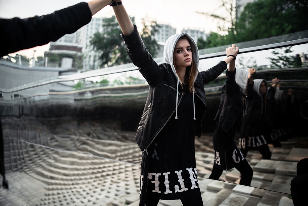 woman raising hands