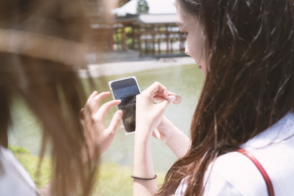 woman holding smartphone