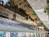 Close-up of clean graffiti technique on a city sidewalk.