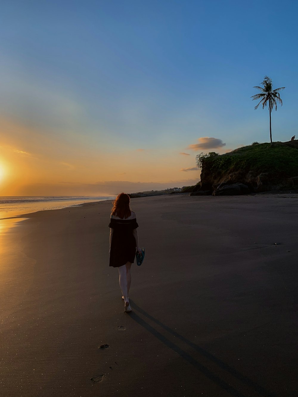 woman walking near ocean