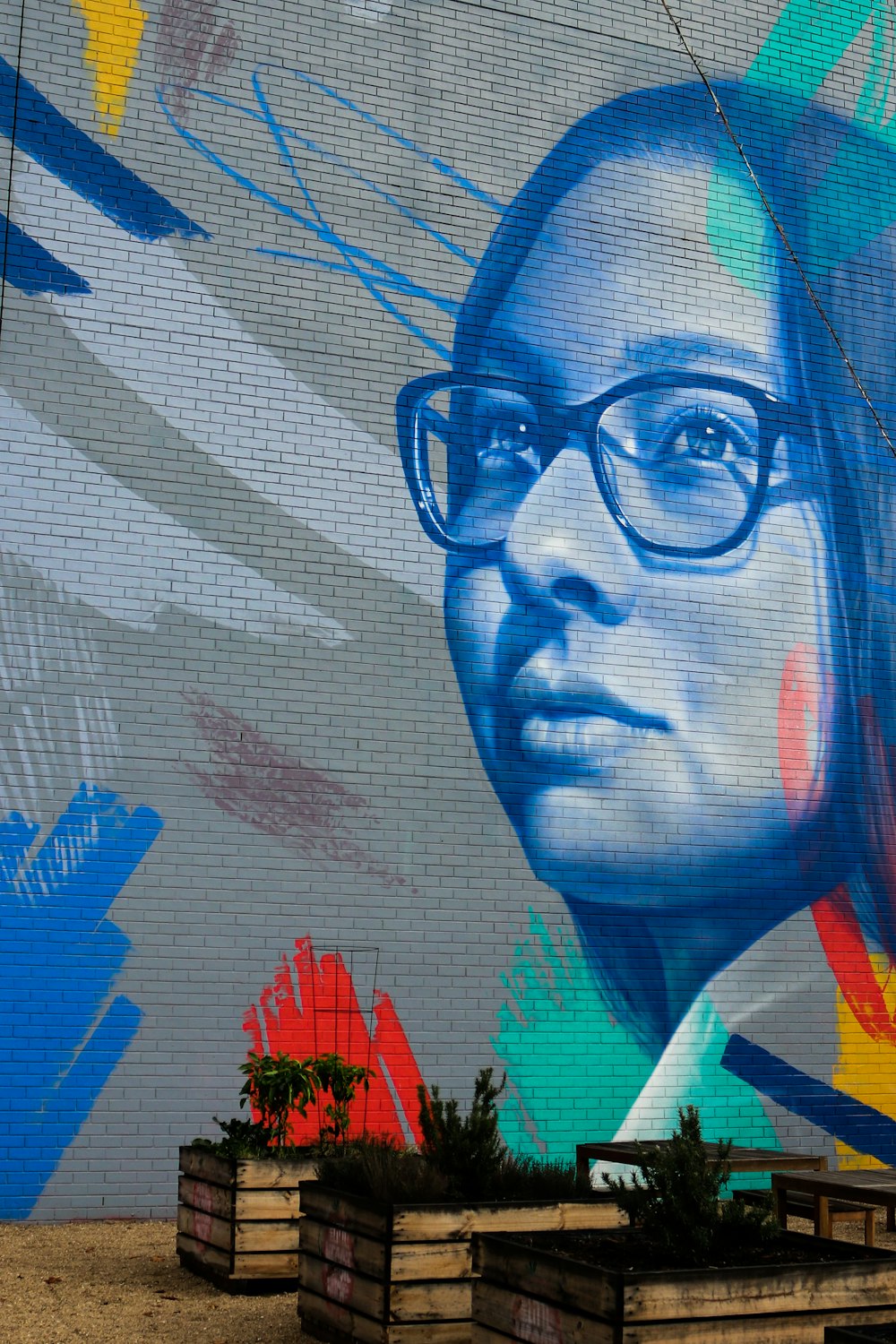 woman in eyeglasses wall painting