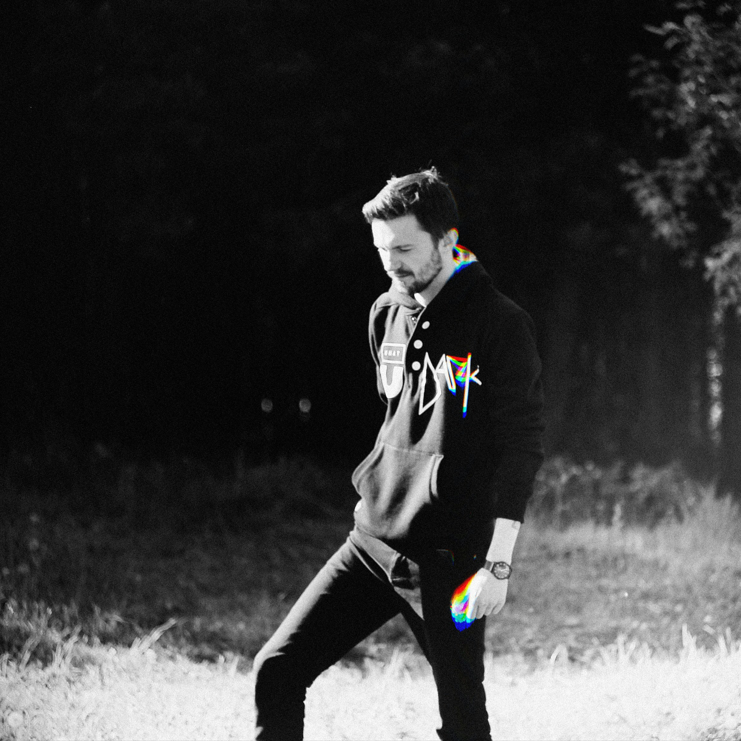 grayscale photo of man pullover hoodie