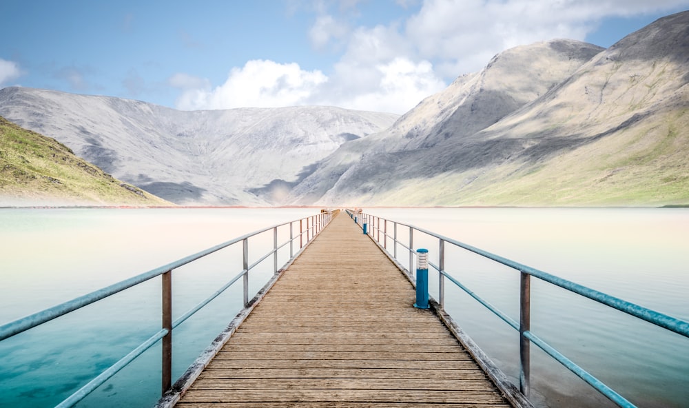 dock leading to mountain