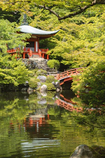 red temple near body of water