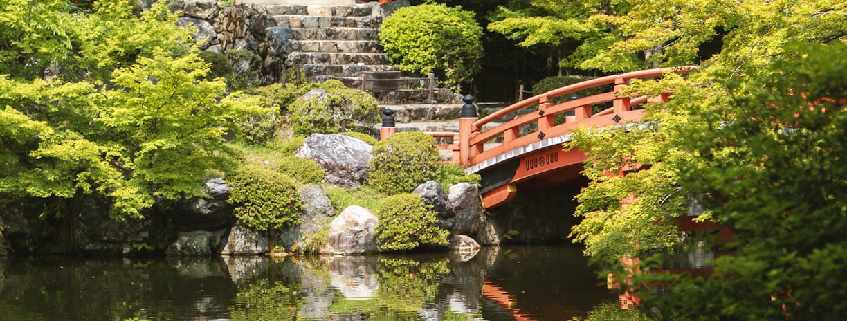 red temple near body of water