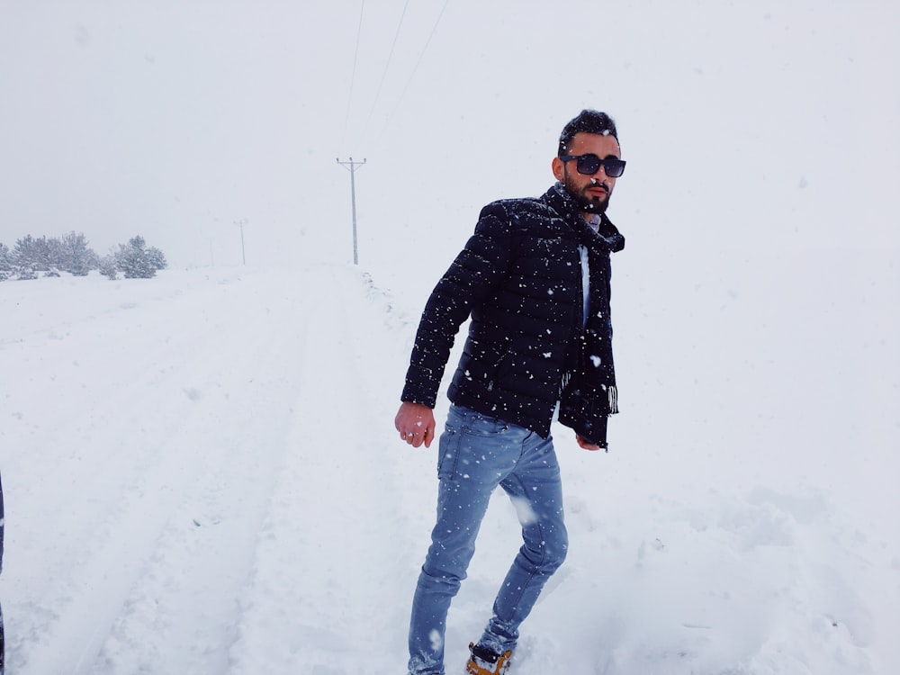 man standing on snow