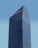 A modern skyscraper with a glass facade and the logo of BNP Paribas displayed prominently at the top against a clear blue sky. The building is characterized by its rectangular shape with vertical lines, creating a sleek and professional appearance.