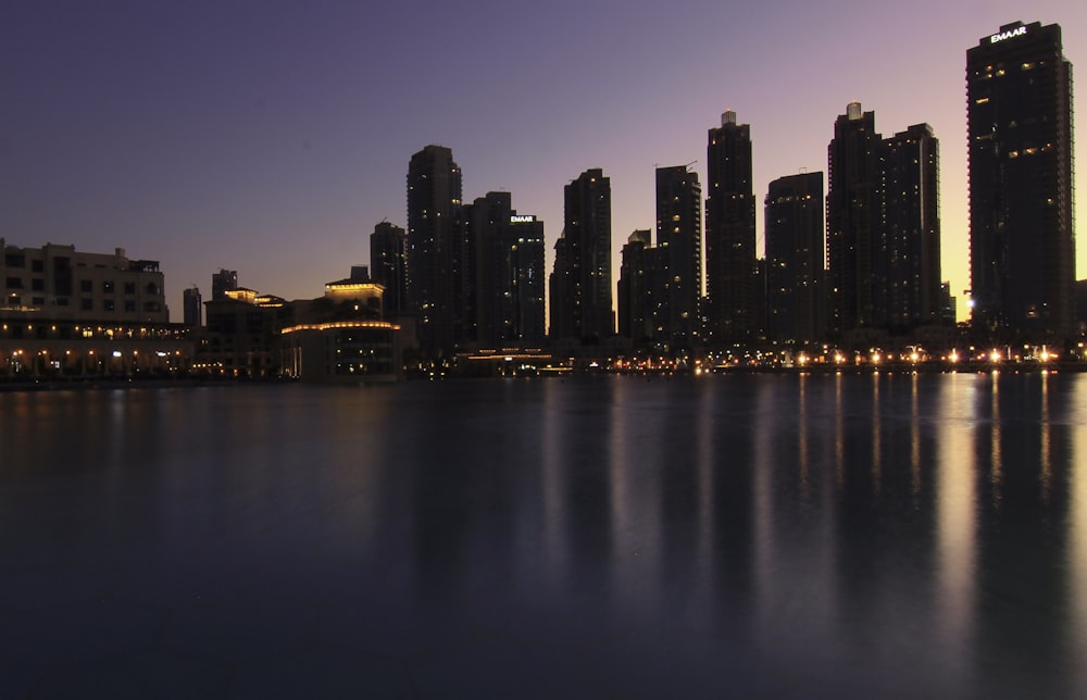 buildings near body of water during nighttime