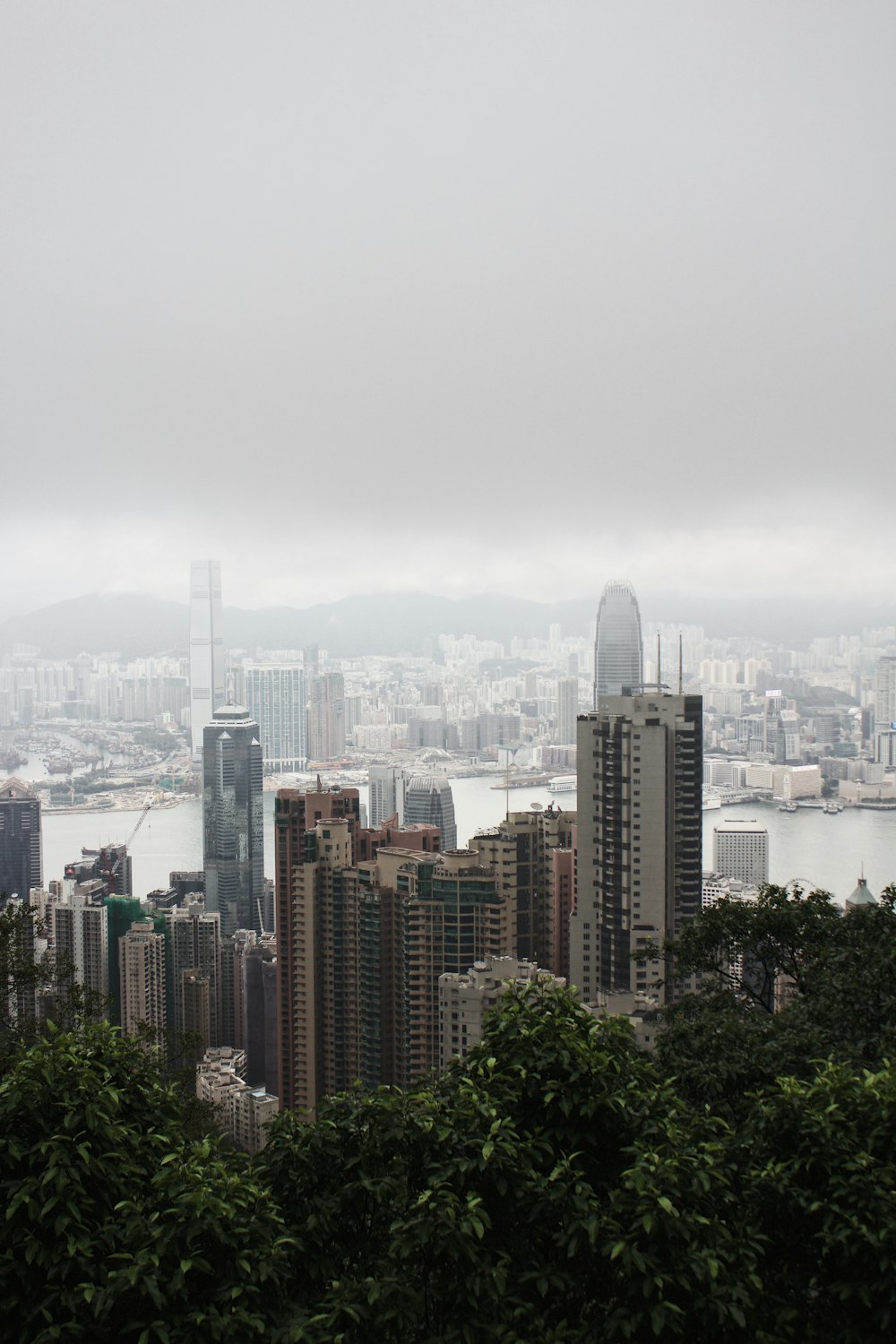 gray high rise buildings under cumulus clouds