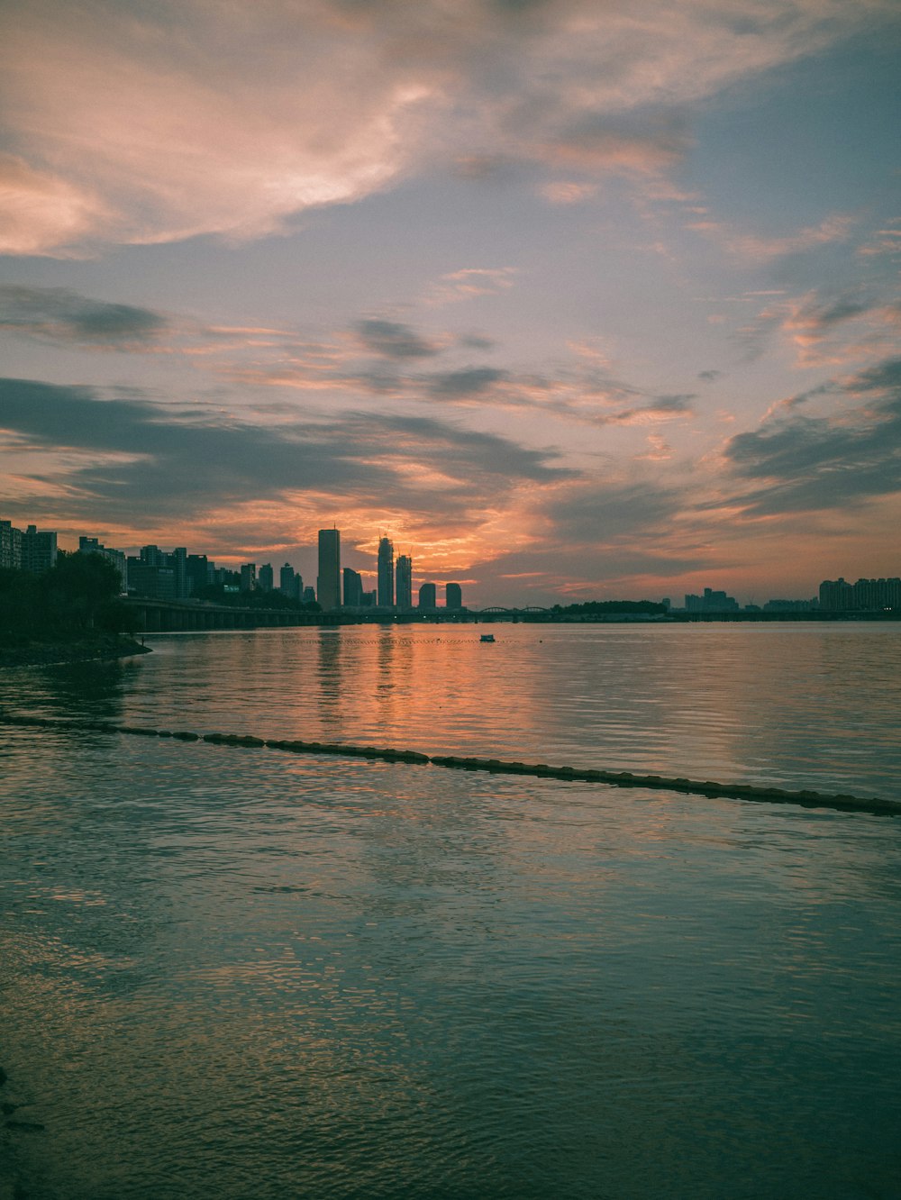 calm body of water during sunset