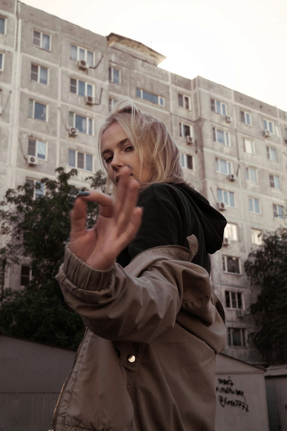 woman wearing gray jacket