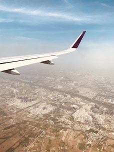 Aerial view of plots near Noida International Airport with clear skies.