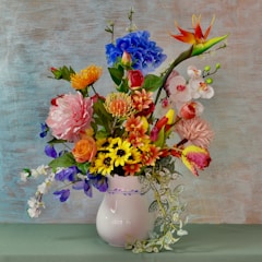 assorted flowers in white vase