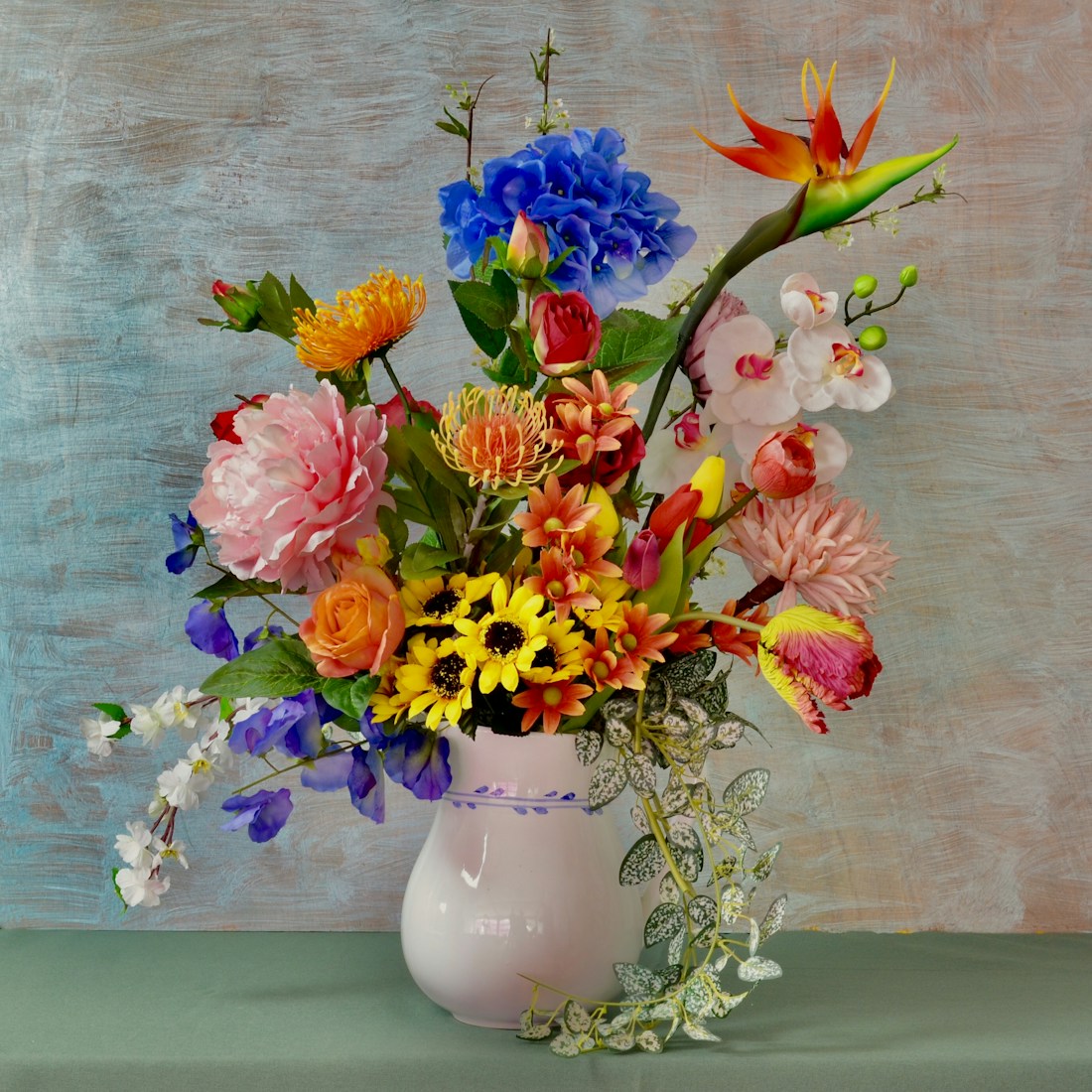 Bright mixed arrangement in a ceramic vase