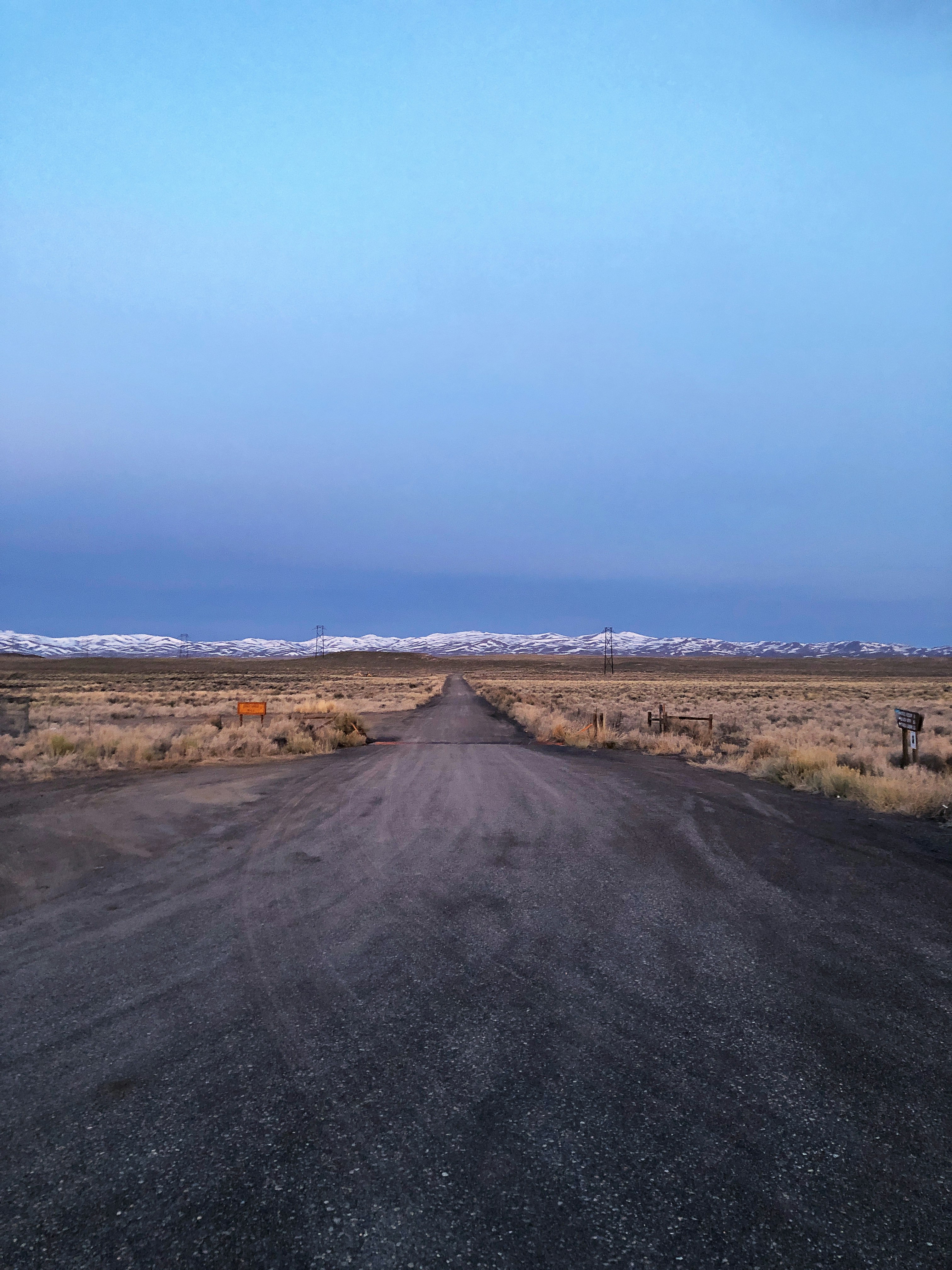 dirt road and mountains at the distance during day