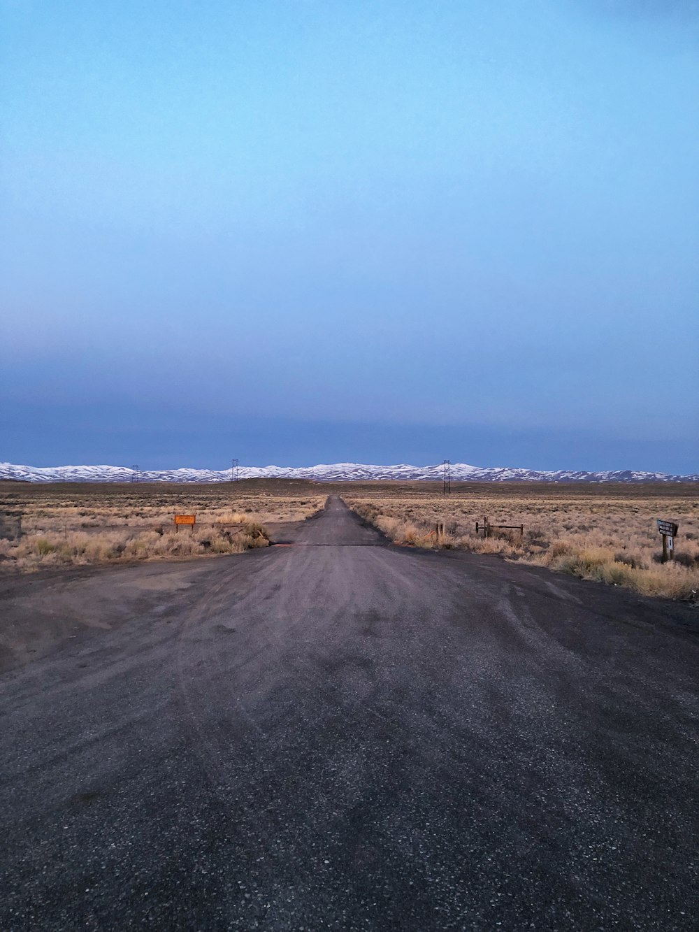 dirt road and mountains at the distance during day