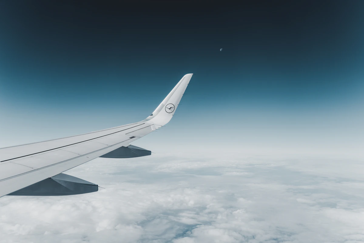 Airplane wing above the clouds