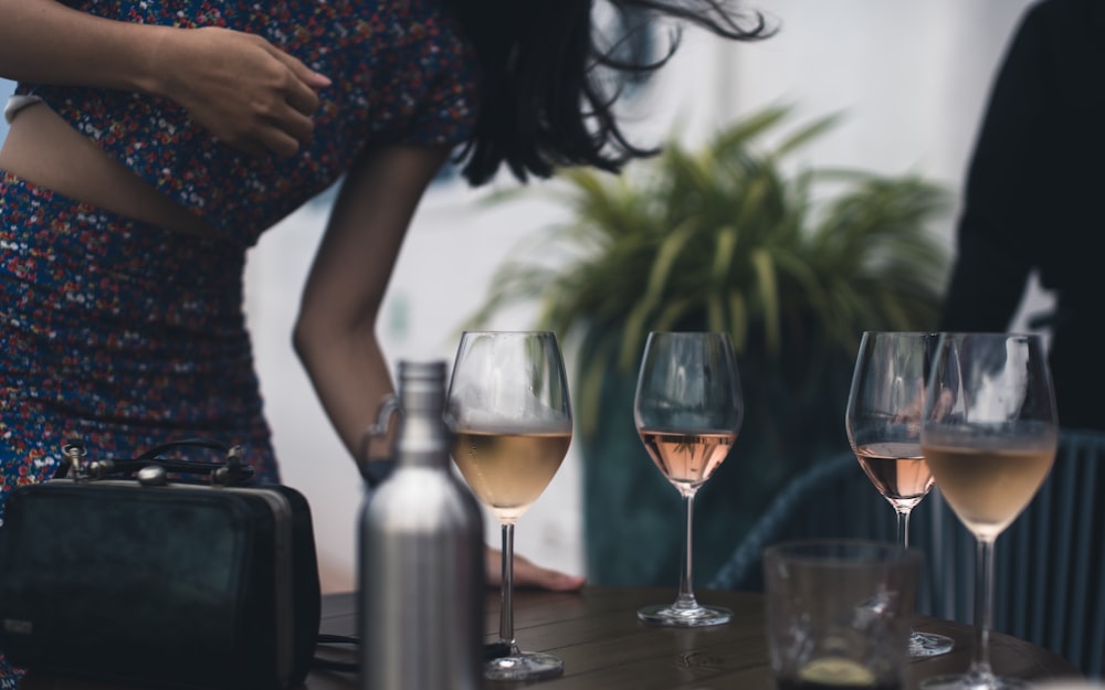 four wine glasses on table