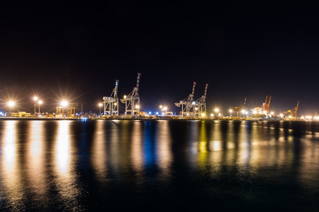 Night shot of Nhơn Trạch LNG terminal illuminated with operational lights and equipment
